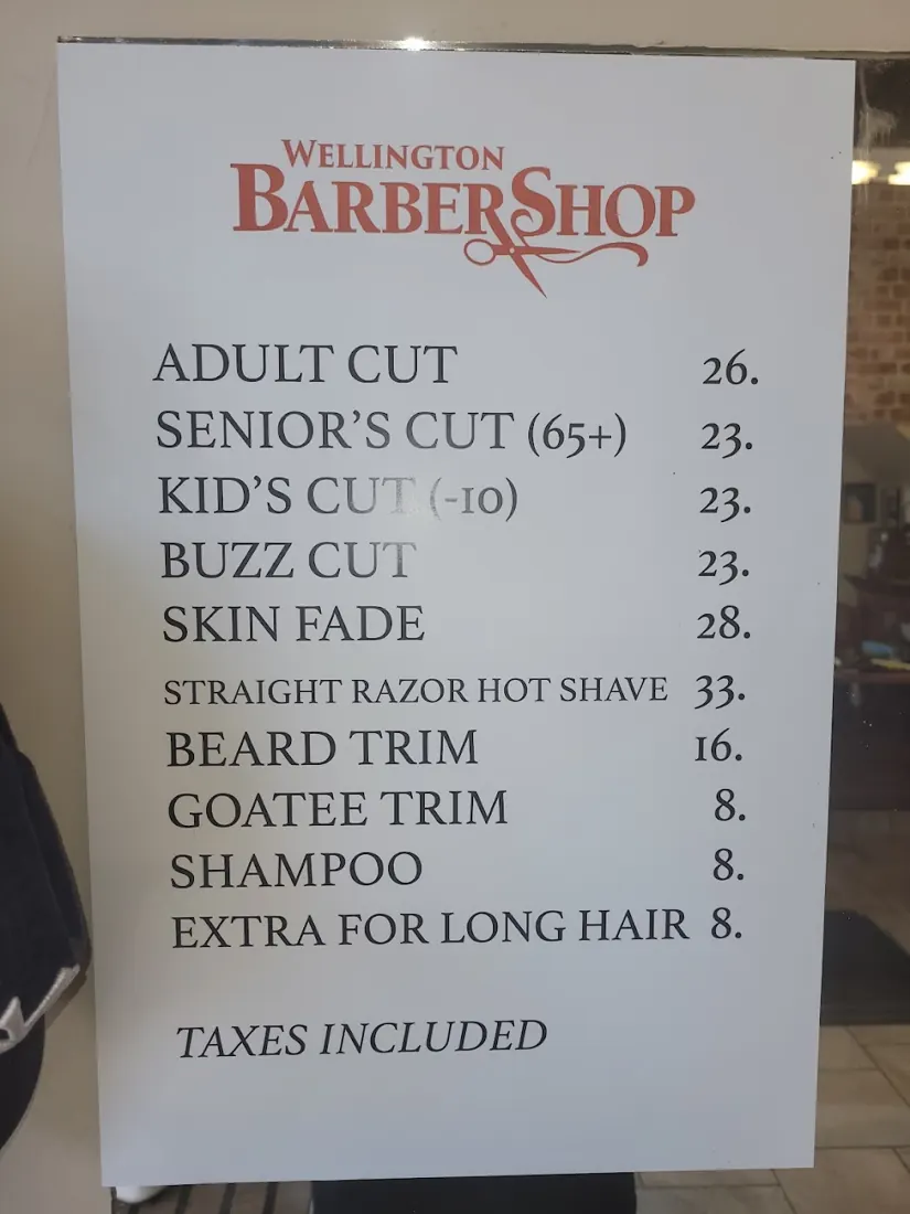 Printed Wellington Barber Shop price board posted at the shop